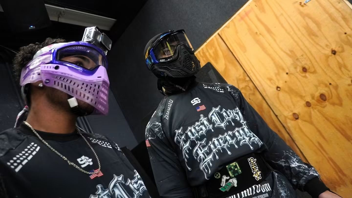 Two East Coast Energy players showing matching custom jersey designs