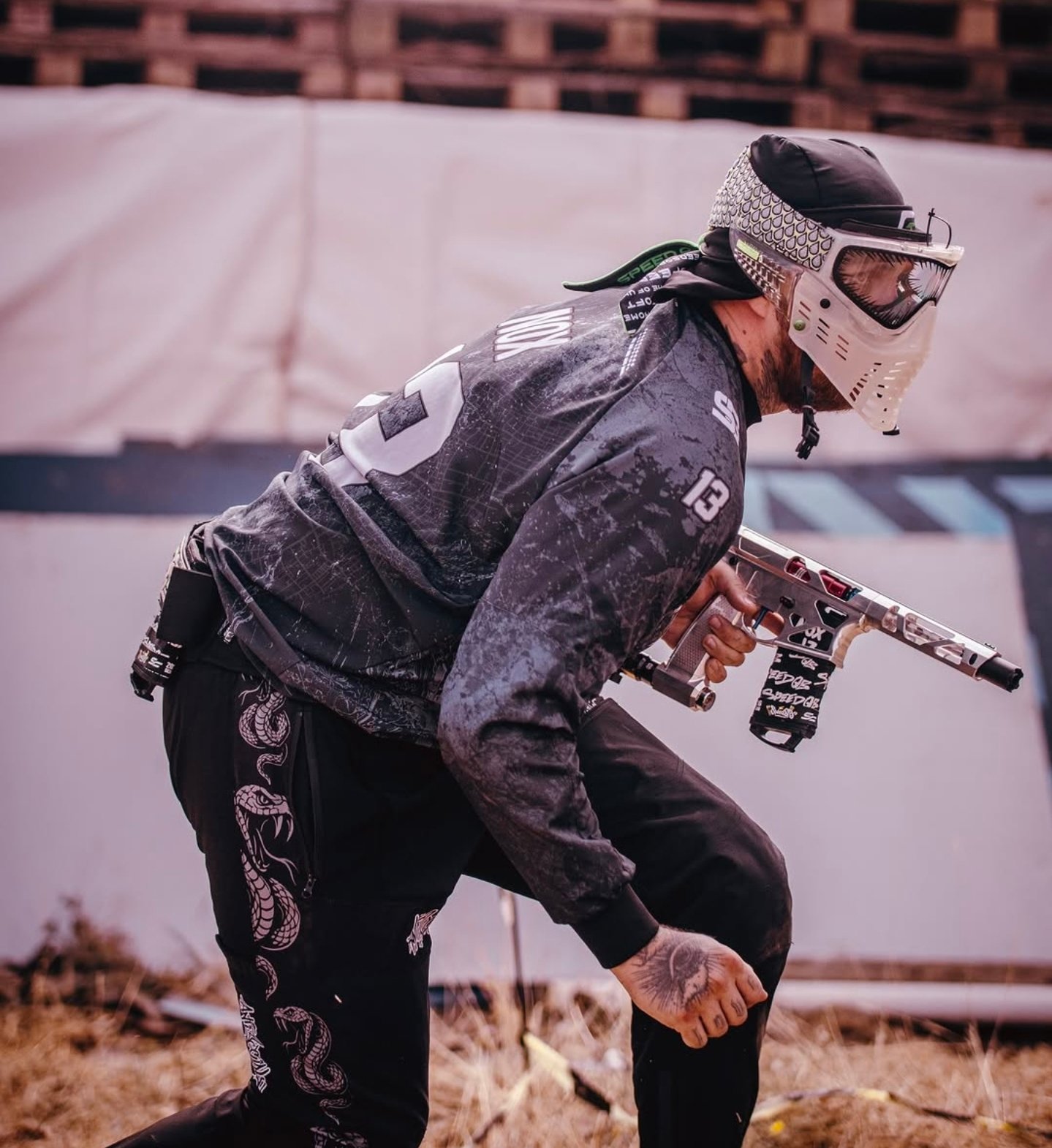 RUSH Academy player in a grey patterned jersey outdoors